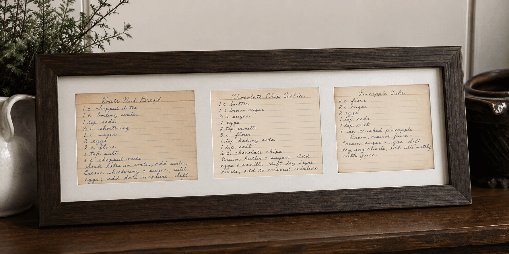 Handwritten letter with conservation-grade tissue beside it, archival mat partially placed over.