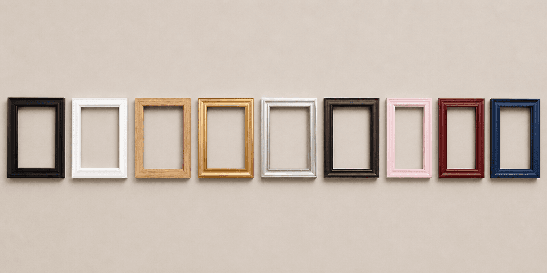 Row of nine empty frames in black, white, natural oak, gold, silver, walnut brown, pink, red, and navy blue against a warm neutral wall