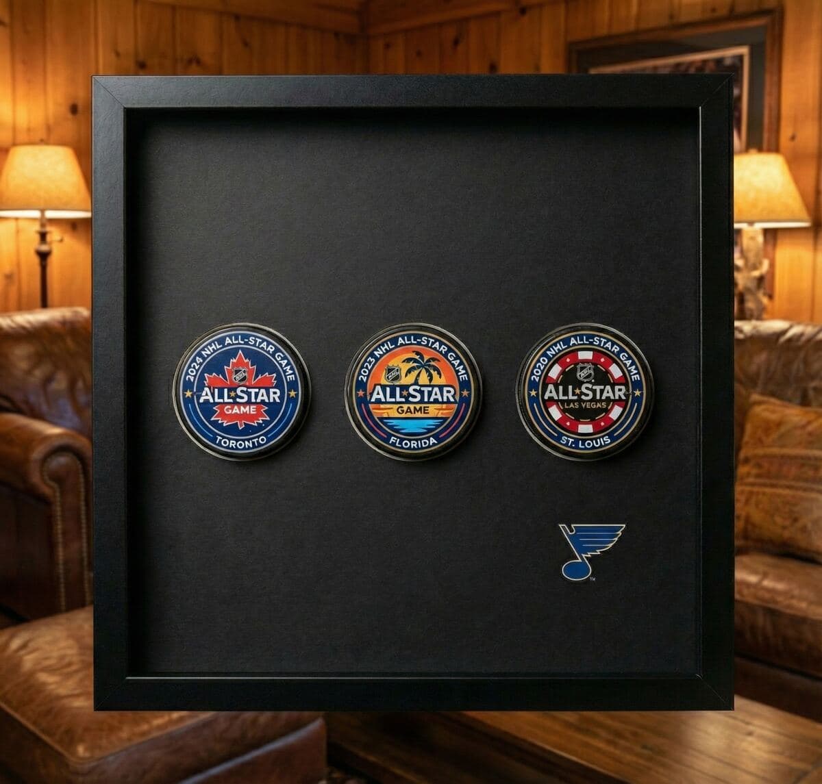 Framed signed hockey puck displayed on a wall