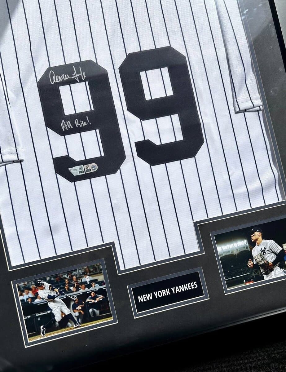 Autographed New York Yankees jersey framed for an NY metro collector with archival mounting, navy team-color matting, and engraved nameplate