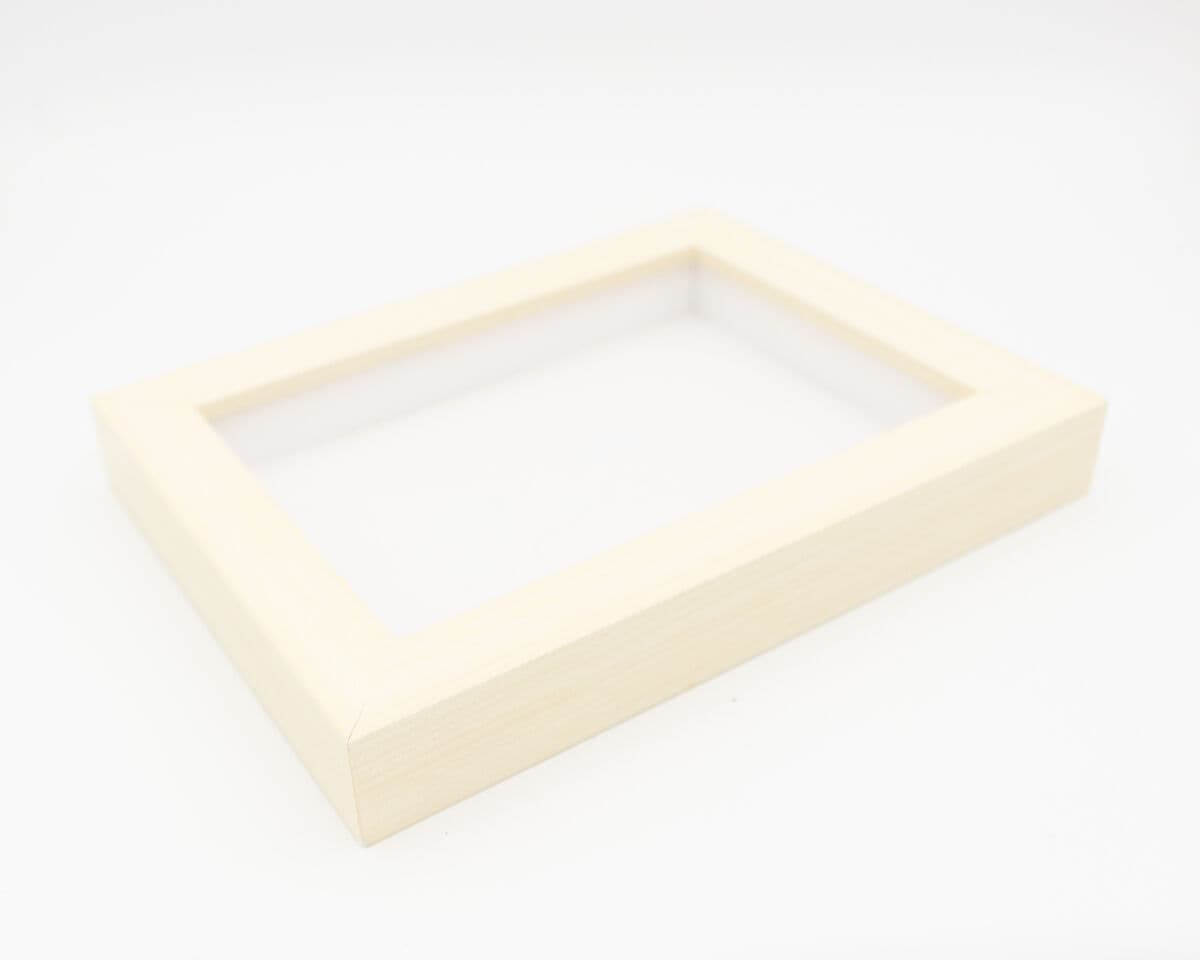 Coastal whitewash shadowbox frame displaying dimensional memorabilia demonstrating traditional shadow box framing for collectible displays using shabby chic white finish