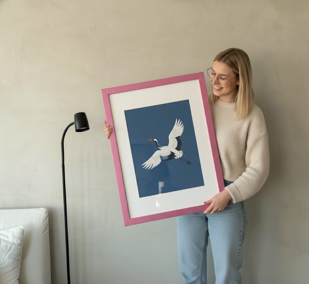 Pink Picture frame displaying abstract art with pink turquoise and gold ink swirls on sunlit wall demonstrating vibrant finish for contemporary fluid artwork