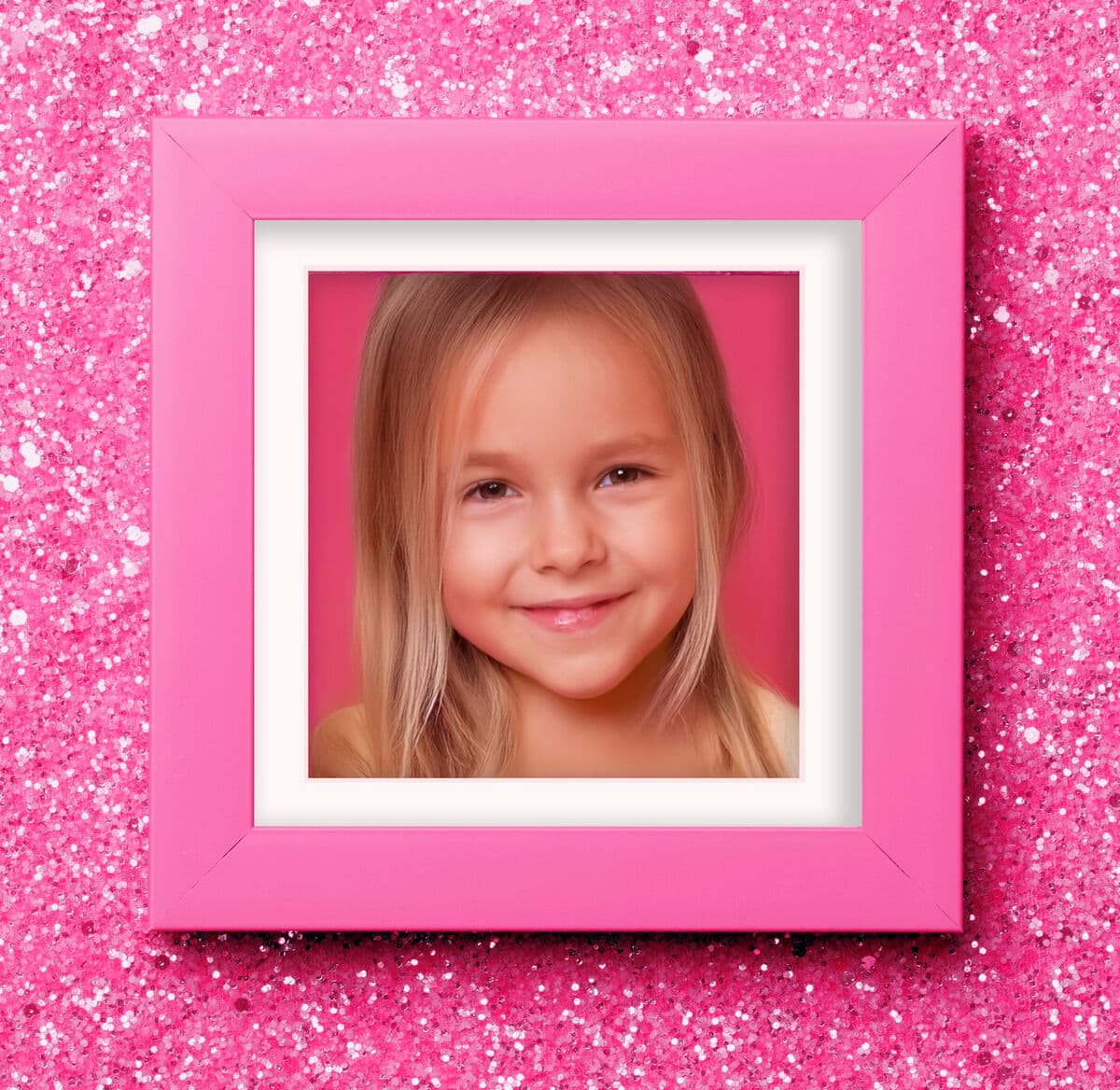 Pink Picture Frame gallery wall featuring playful art including cupcakes unicorns kittens and abstract prints arranged over white shelf showcasing whimsical pink styling for children's spaces
