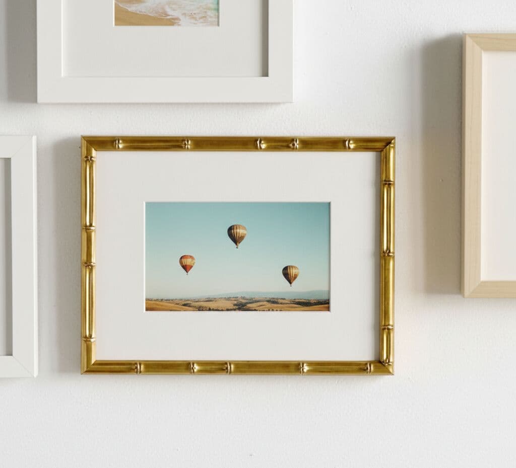 Bamboo Gold Frame close-up detail showing bamboo-style segments framing landscape photography with visible metallic gold finish and classic matting