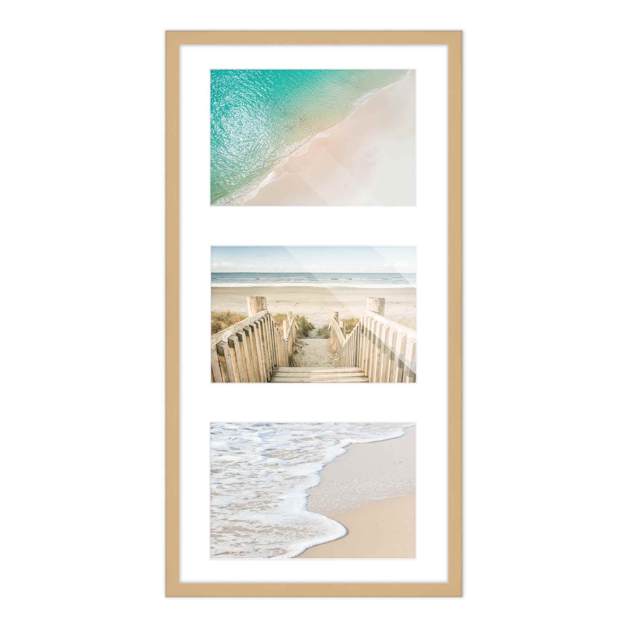 Tall narrow Natural Wood frame holds three coastal photographs of turquoise shoreline wooden boardwalk and waves on sand stacked vertically with white mats