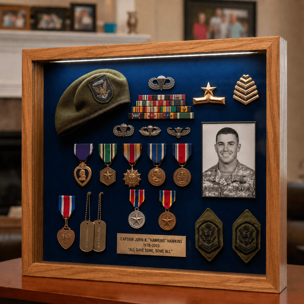 Memorial shadow box with a folded flag, service medals, and a portrait in a wood frame