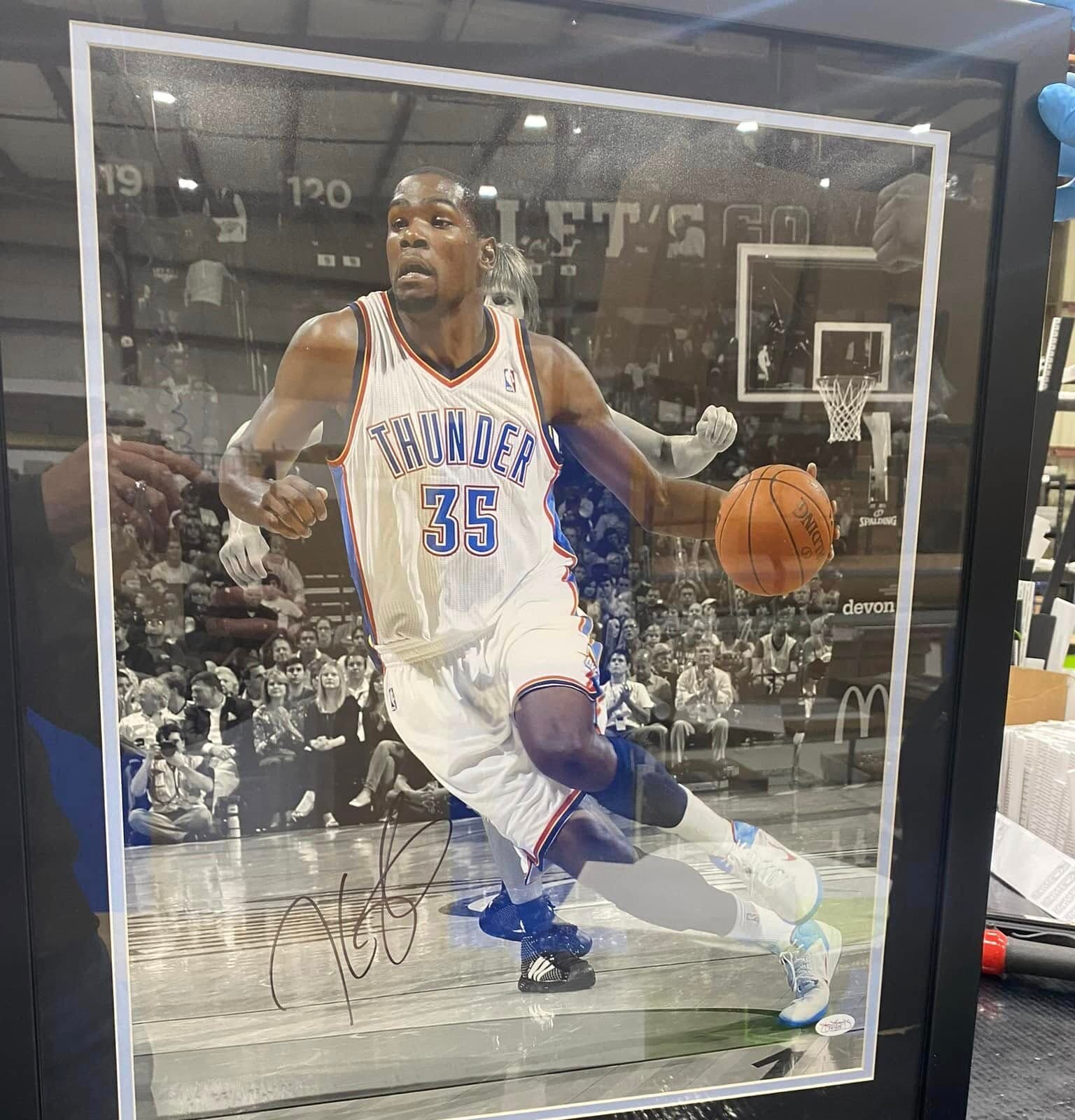 Signed Kevin Durant Oklahoma City Thunder #35 action shot framed with white double mat and 'The Slim Reaper' nameplate