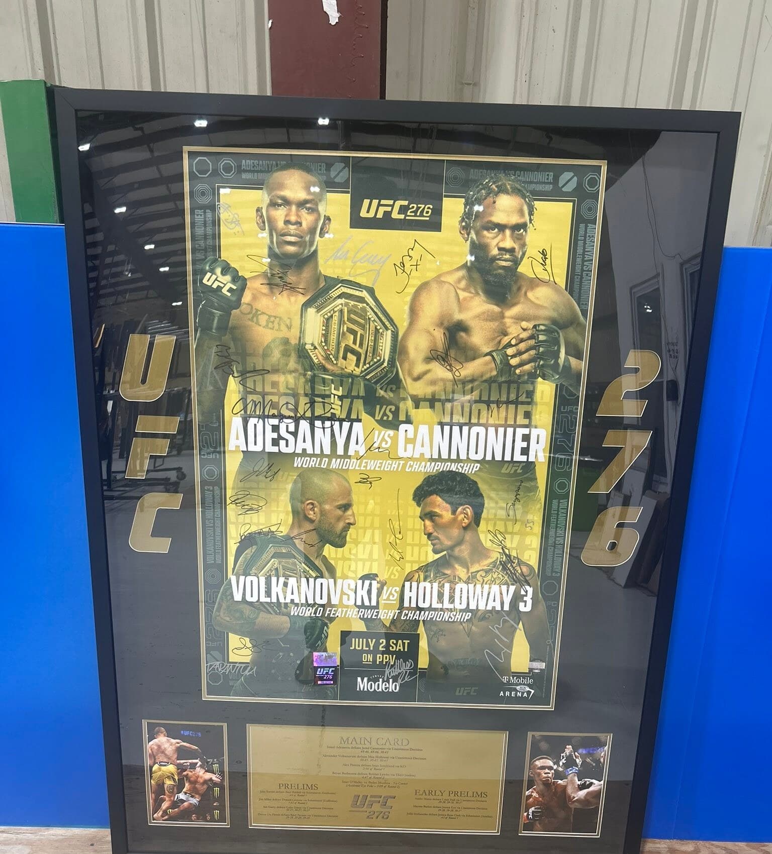 Multi-signed UFC 276 Adesanya vs Cannonier and Volkanovski vs Holloway event poster framed in a black moulding with twin action shots and engraved fight-card plaque