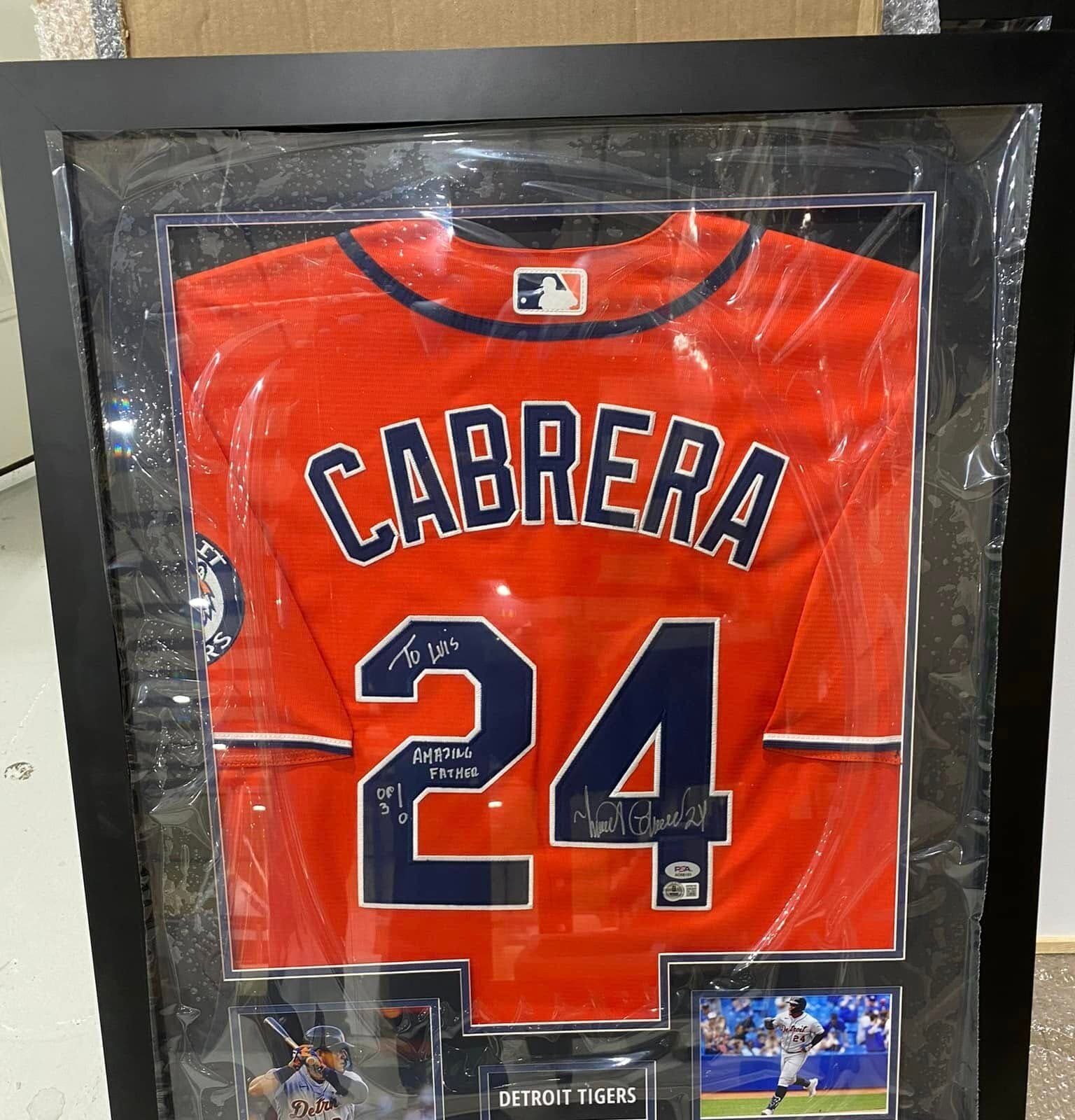 Inscribed Miguel Cabrera Detroit Tigers #24 orange alternate jersey framed with twin action photos and 'Detroit Tigers' nameplate