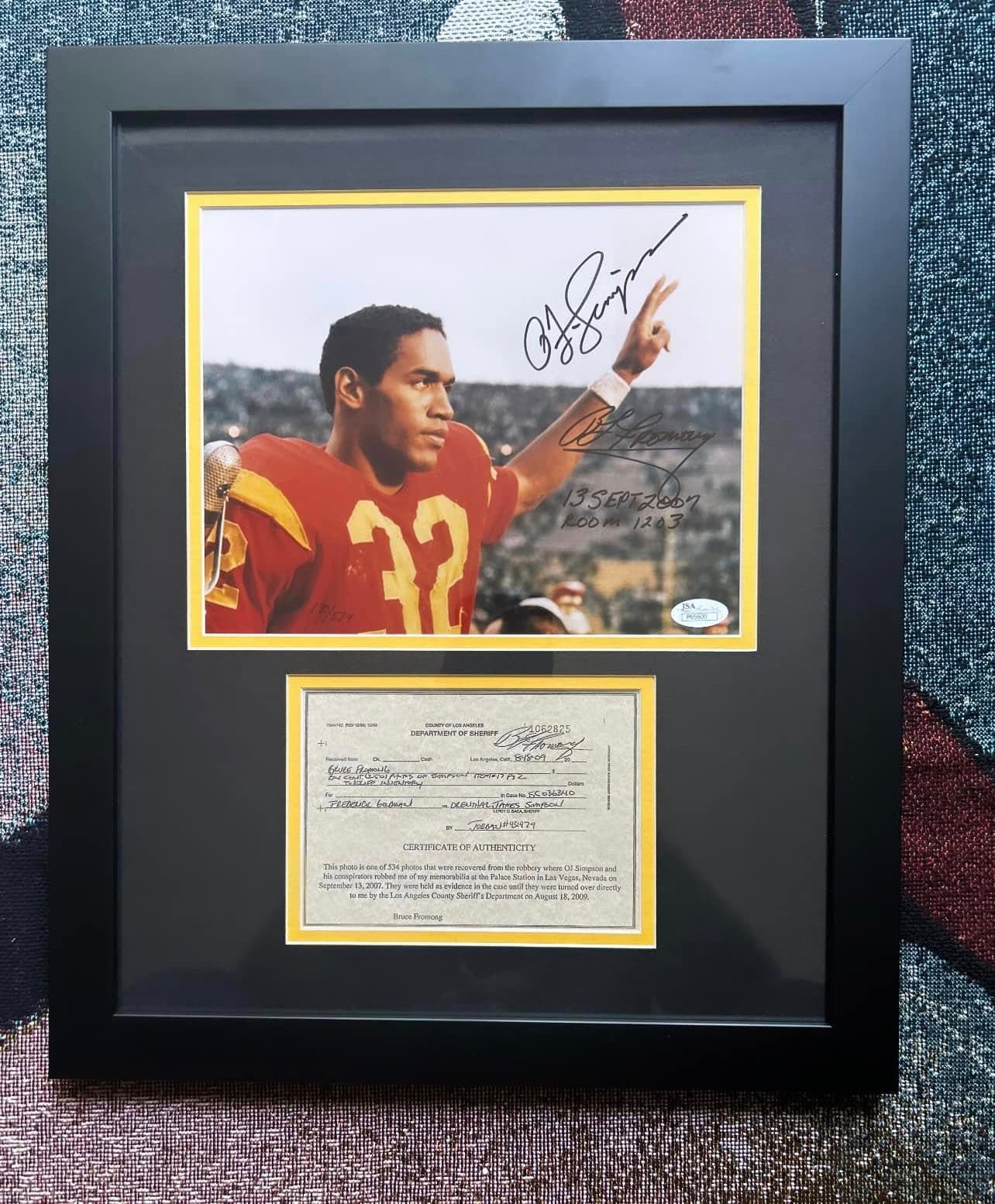 JSA-authenticated signed O.J. Simpson USC Trojans #32 print framed in a black moulding with a yellow inner mat, displayed alongside the original Los Angeles County Sheriff's Department evidence release form as the certificate of authenticity