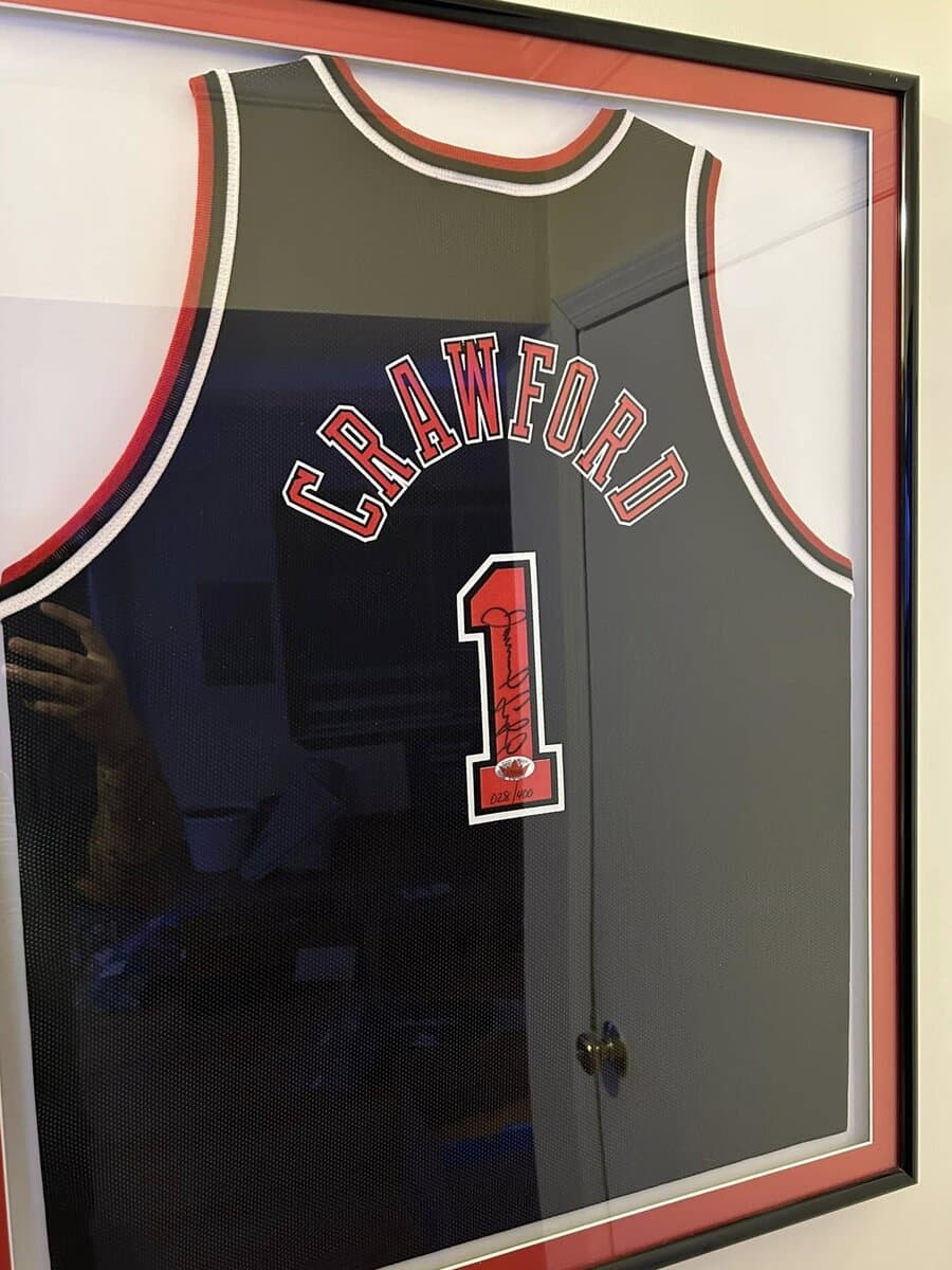 Autographed Jamal Crawford Chicago Bulls #1 jersey custom framed with red border matting in deep shadow box