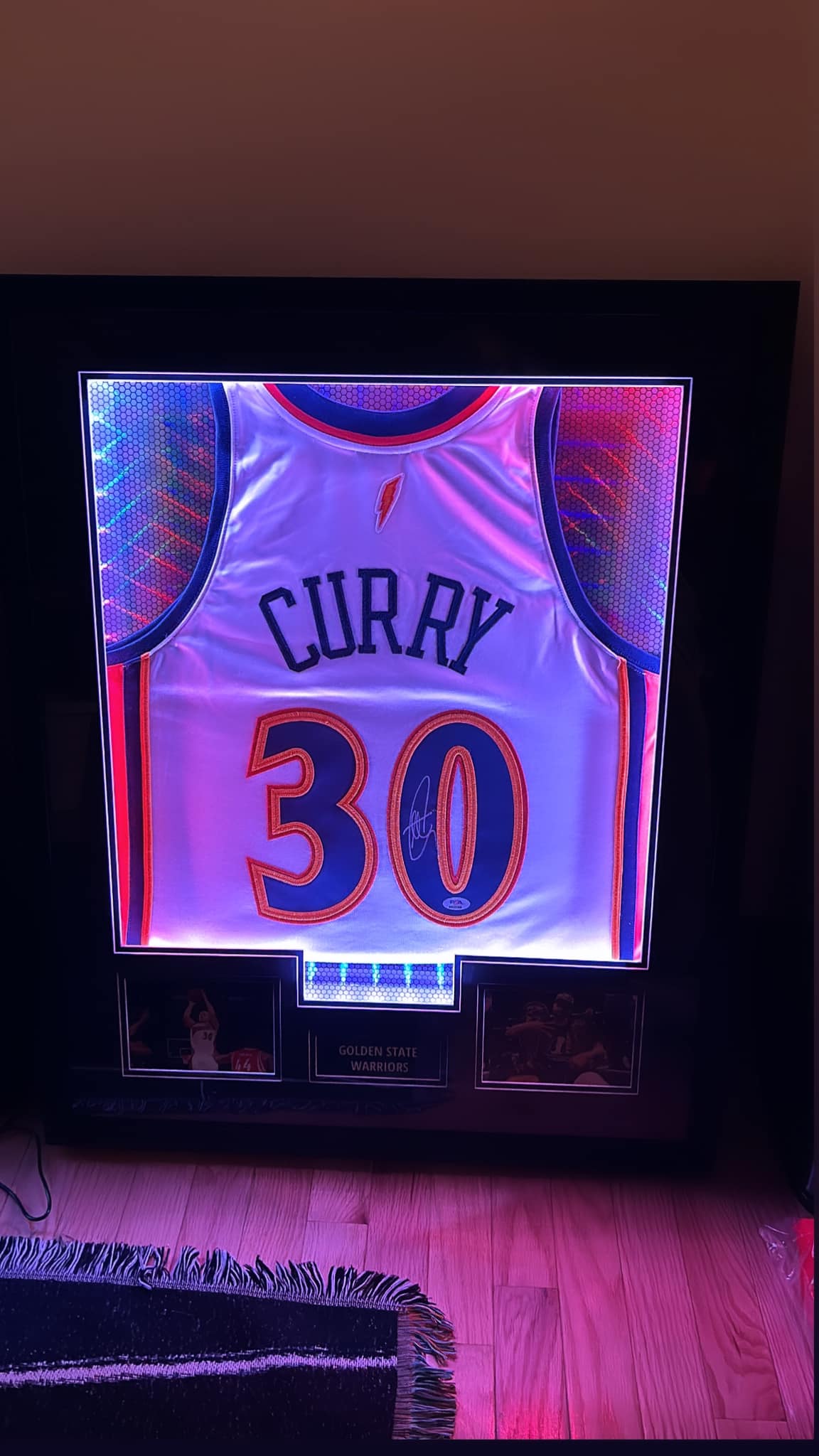 LED-illuminated jersey shadow box: autographed Stephen Curry Warriors #30 jersey with integrated backlighting on, stadium-style centerpiece display
